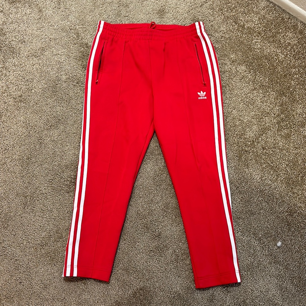 Red Adidas track pants